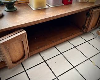 Vintage MCM coffee table with center cabinet and caning on both sides