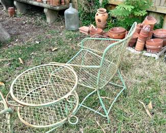 Vintage green metal set, including chaise lounge, two chairs with connecting round table with umbrella holder, and side table