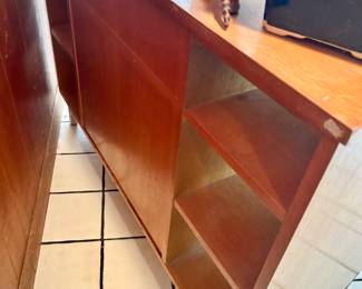 Vintage MCM credenza - 6 shelves, 1 wide drawer, 1 pullout shelf, 6 shelves. Back is finished, can be used in middle of the room.