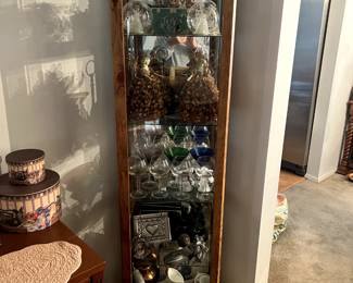 . . . a nice petite curio cabinet stuffed with treasures