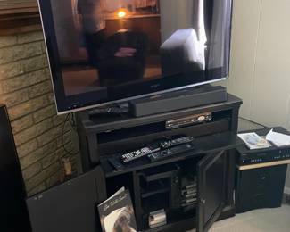 . . . nice flat-screen TV with TV stand 