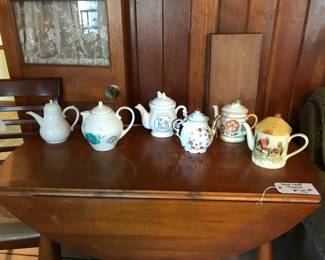Teapots, dropleaf table