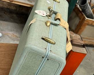 Vintage suitcase with key and old luggage tag