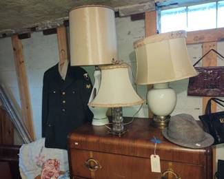 Military uniforms Waterfall dresser Vintage lighting 