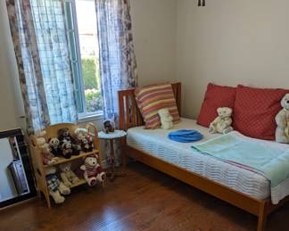 Twin Bed and collectibles. Curtains and rods are also for sale
