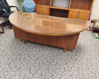 Half-moon shaped executive desk