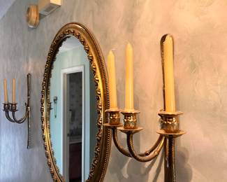 Brass wall sconces and solid plaster gilded mirror 