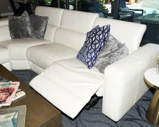 This Z Gallerie leather sectional is reclining on both ends and the head rest is adjustable.  