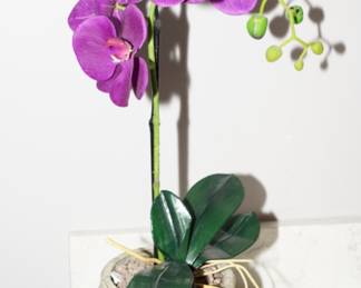 Faux lavender orchid in stone planter