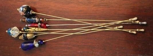 233 - Group of hatpins, 8"

