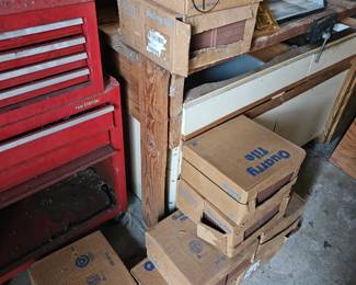 Multiple boxes of Quarry tile and more on a shelf. $100 takes all. Prolly 400 in all