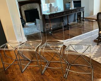 4 acrylic bar stools - heavy and durable. not easily turned over because of heavy metal bases. Bar stools are Gabby fromSummer Classics. Retail over $400 each. Selling for $600 for all 4. 
