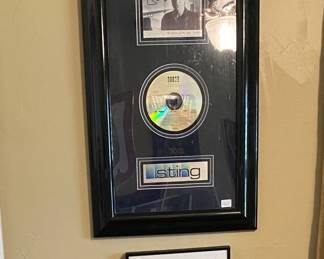 Framed and autographed CD by Sting