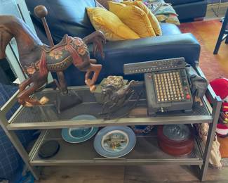Decoratives everywhere, from wooden horses, electric antique adding machine and more