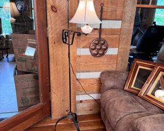 Wrought iron floor lamp with milk glass body 62"H with 22" width rod to edge of shade 