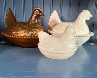 Trio of hens on nest, two milk glass and one amber