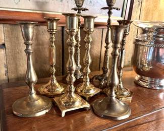 Group of tall brass candlesticks, the tallest is 9"