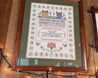 Cross stitch sampler with houses and floral border 26" x 22"