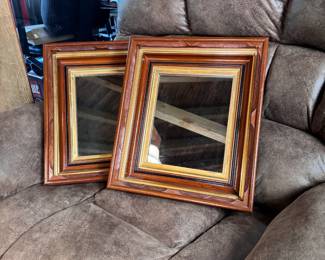 Pair of mirrors with deep carved frames with gold and black borders 17" x 14"