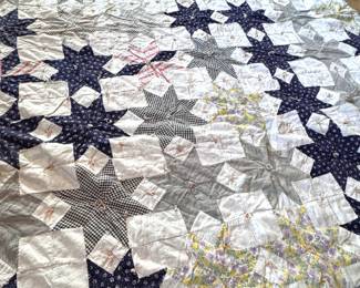 Patchwork star quilt with ties, thick batting, and striped backing 72" x 54"