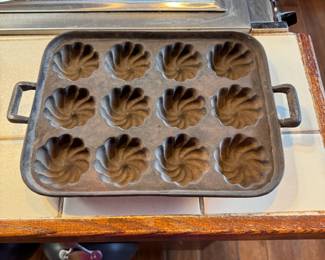 Antique cast iron swirl muffin pan 11"L x 8"W