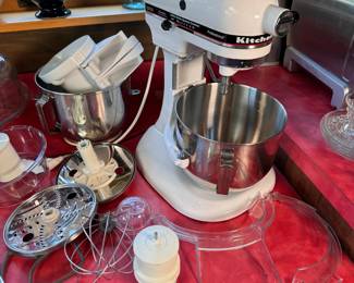 Kitchen Aid professional mixer with multiple bowls and attachments
