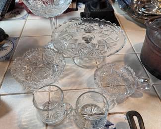 Group of cut and pressed glass including sugar & creamer, hobswirl bowl & nappy, cake stand 9"W with diamond & fan, and thistle tall compote 