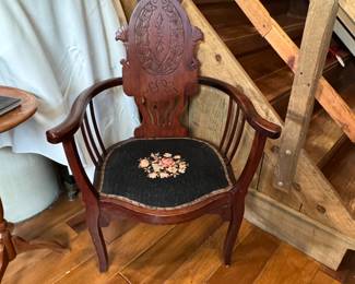 Regency mahogany armchair with black floral embroidered seat, one back leg has a hairline crack, 36"H x 25"W