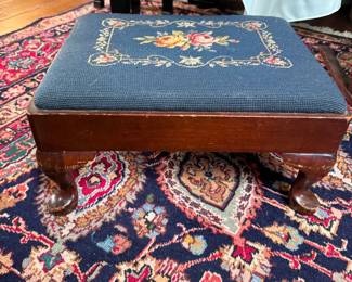 Dark blue floral needlepoint footstool, legs show some scratches 8"H x 14"L x 18"W