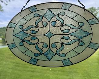 Oval painted glass sun catcher 13"W