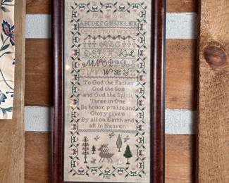 Tall cross stitch sampler with floral border and forest animals 1991, 28"H x 14"W