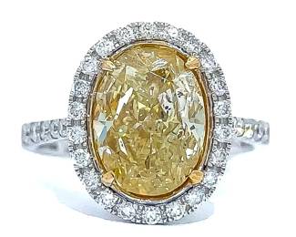 5.09 Carat Natural Fancy Yellow Diamond & White Diamond Oval Halo Ring in 18k Gold