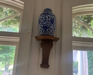 Pair of these antique brackets and blue pottery urns. 