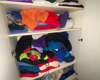 Cabinet of Fabric and Plain Colored Tshirts.