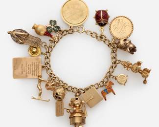 42. 14k Charm Bracelet w/ 17 Gold Charms: Litacharm, Poodle, Jack-O-Lantern etc.