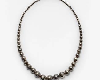 138. Large Sterling Navajo Graduated Pearl Necklace: 24mm-5mm, 32" long