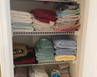 Closet full of towels, linens. 
