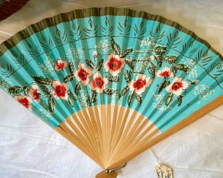Vibrant colored paper/wood fan from the 1950s