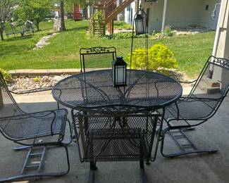 Wrought iron patio with rockers and umbrella (not shown)