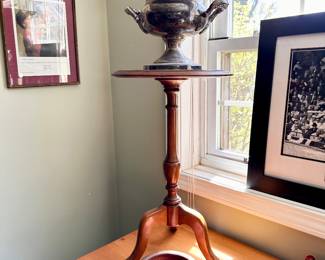 Round oak side table & engraved trophy.