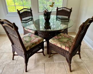 Wicker Glass top table and 4 matching chairs 
Not included with 9 piece set… Oscar Huber 