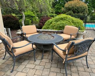 Cast Fire pit  with 4 matching chairs and cushions 