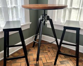 Industrial telescoping table with two bench chairs. So cool!