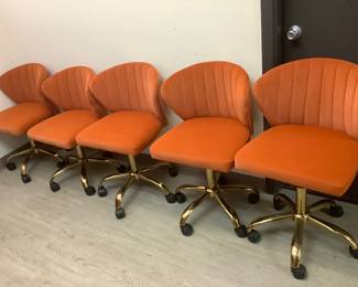 DILA804 70s Orange, Rolling Chairs Set of five vintage style rolling chairs. Adjustable height, seats measure 16" deep by 19" wide by 14" tall.
