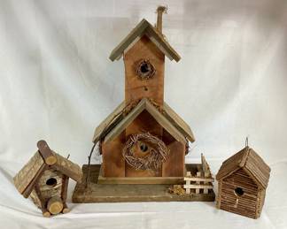 DILA704 Rustic Log Birdhouse Trio A collection of three rustic bird houses. Includes a large birdhouse, and two smaller bird houses. 
