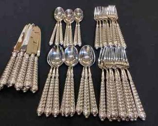 DILA109 Ricco Argentieri Spiral Flatware Set There are 9 pieces of each set, except for the small spoon, which only has 8 pieces. 
