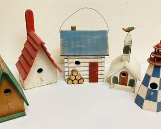DILA705 Agrestic Birdhouse Collection A collection of five rustic birdhouses in various shapes and sizes. Includes two classic bird houses, a lighthouse birdhouse, a church birdhouse, and a cabin birdhouse. 
