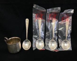 DALI706 Sterling Silver Spoons And Cup An assortment of sterling silver. Includes 4 S. Kirk & Son Sterling silver spoons, 3 of which are new and in unopened packaging, and 1 sterling silver S&B Laart baby's cup. 
