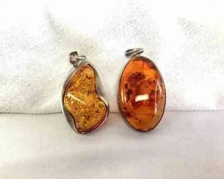HAYE121 Two Large Baltic Amber, Sterling 925, Pendants Two different colored pieces, both stamped 925. Each measure about 2 inches. 
