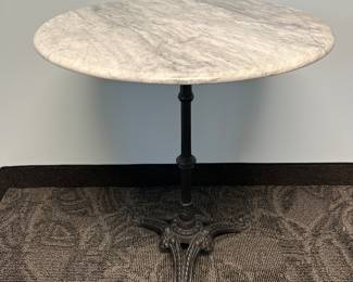 Marble top parlor table with cast base 